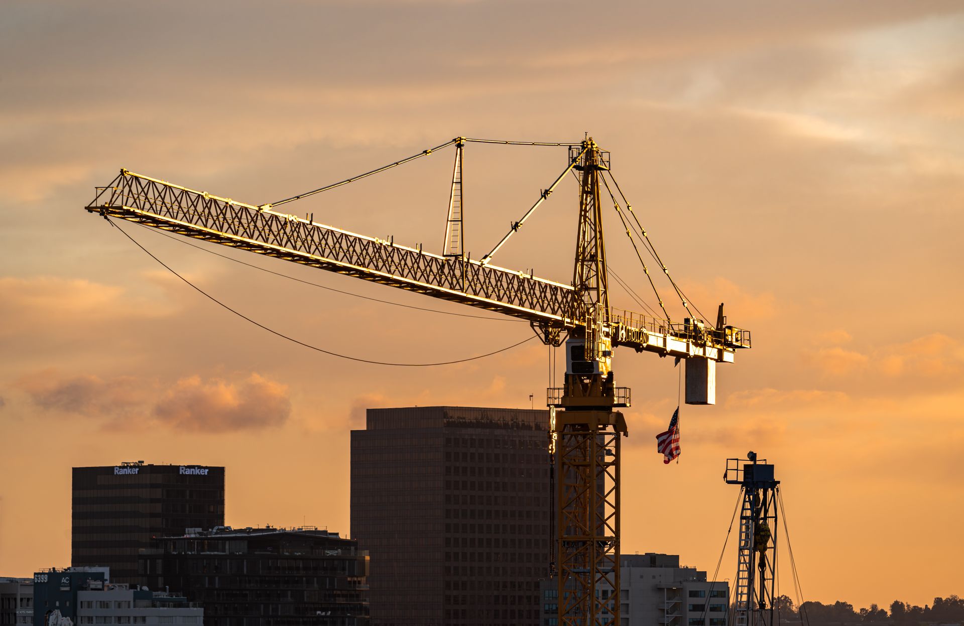Construction crane in dusk sunset